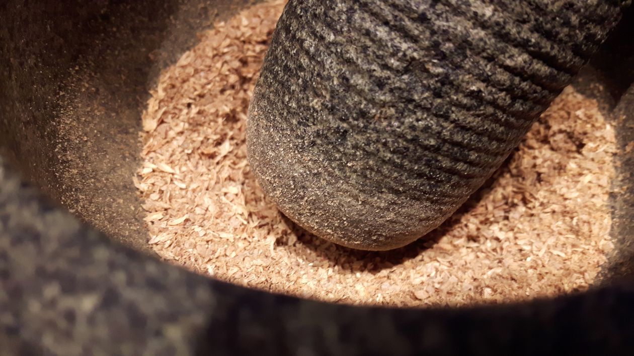 Free photo "Crushed coriander seeds in mortar"