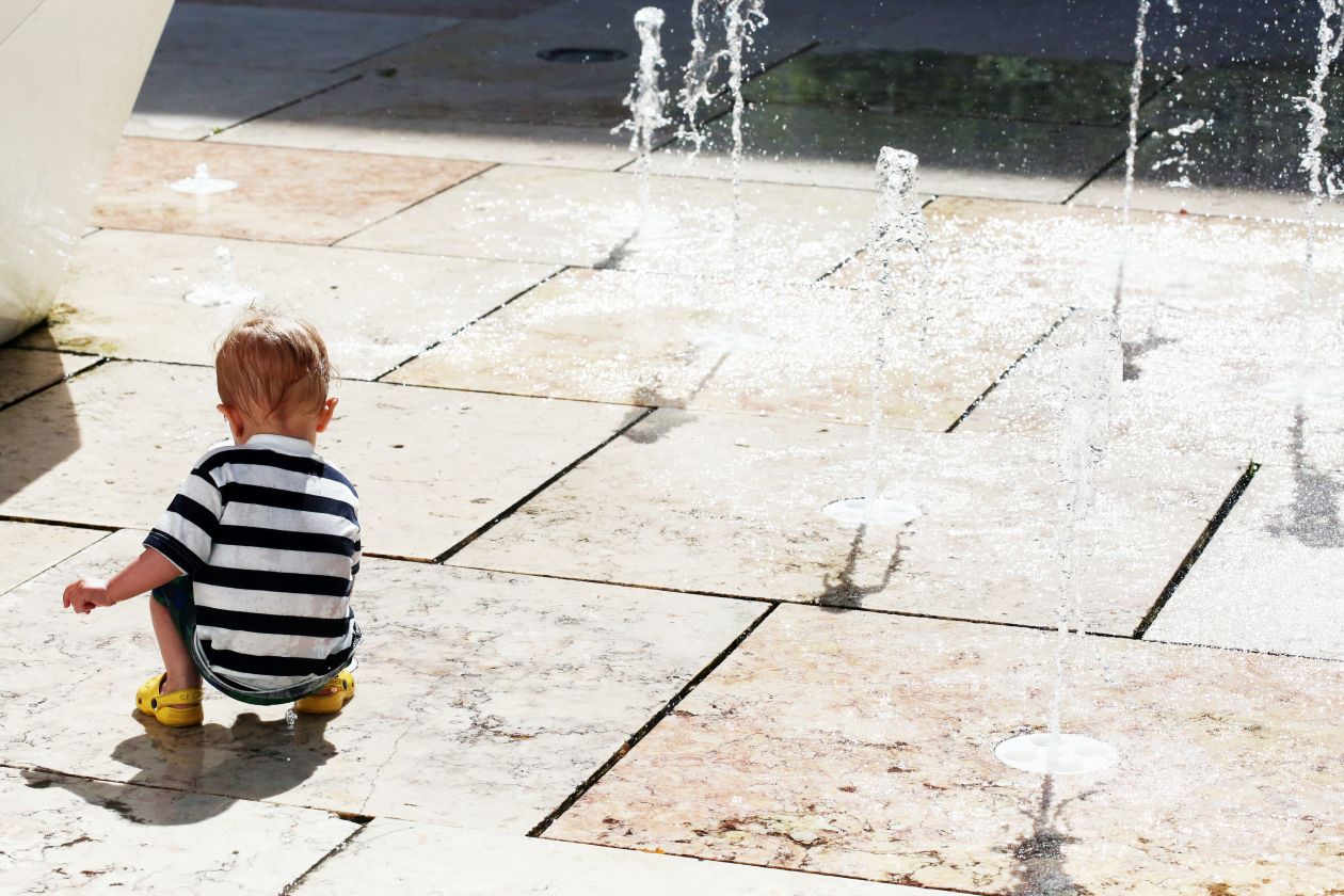 Free photo "Child Plays With Water Jets"